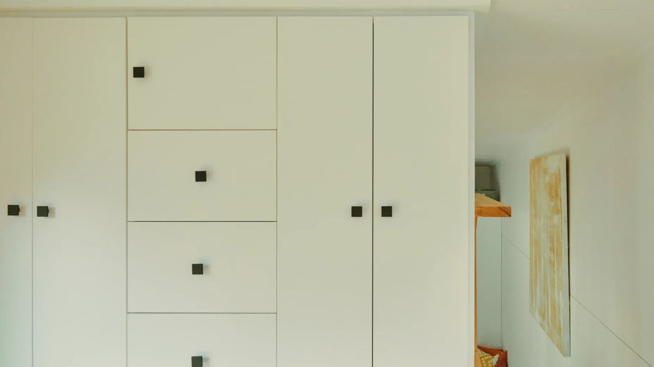 Cupboard is as big as a wall and has ample storage in bedroom