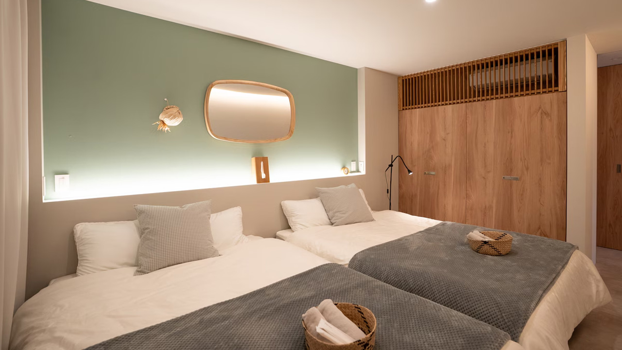 The bedroom is spacious with ample storage