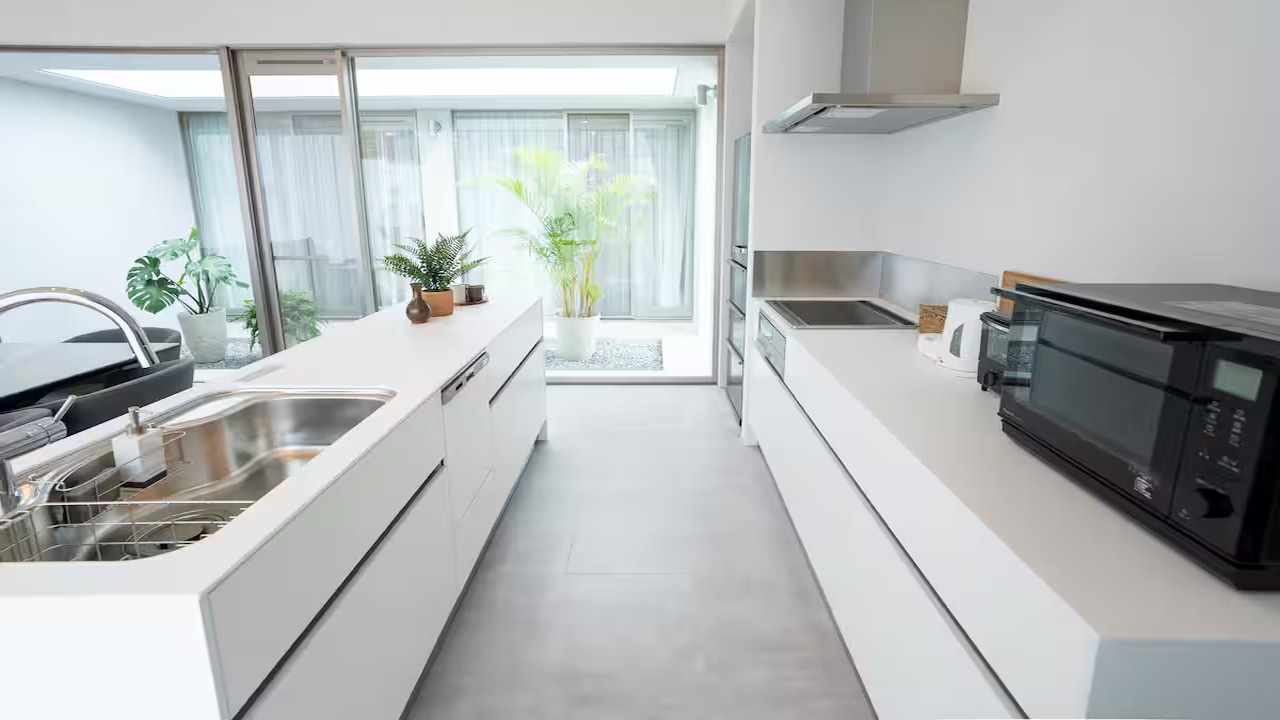 The kitchen has galley layout that is simple and functional