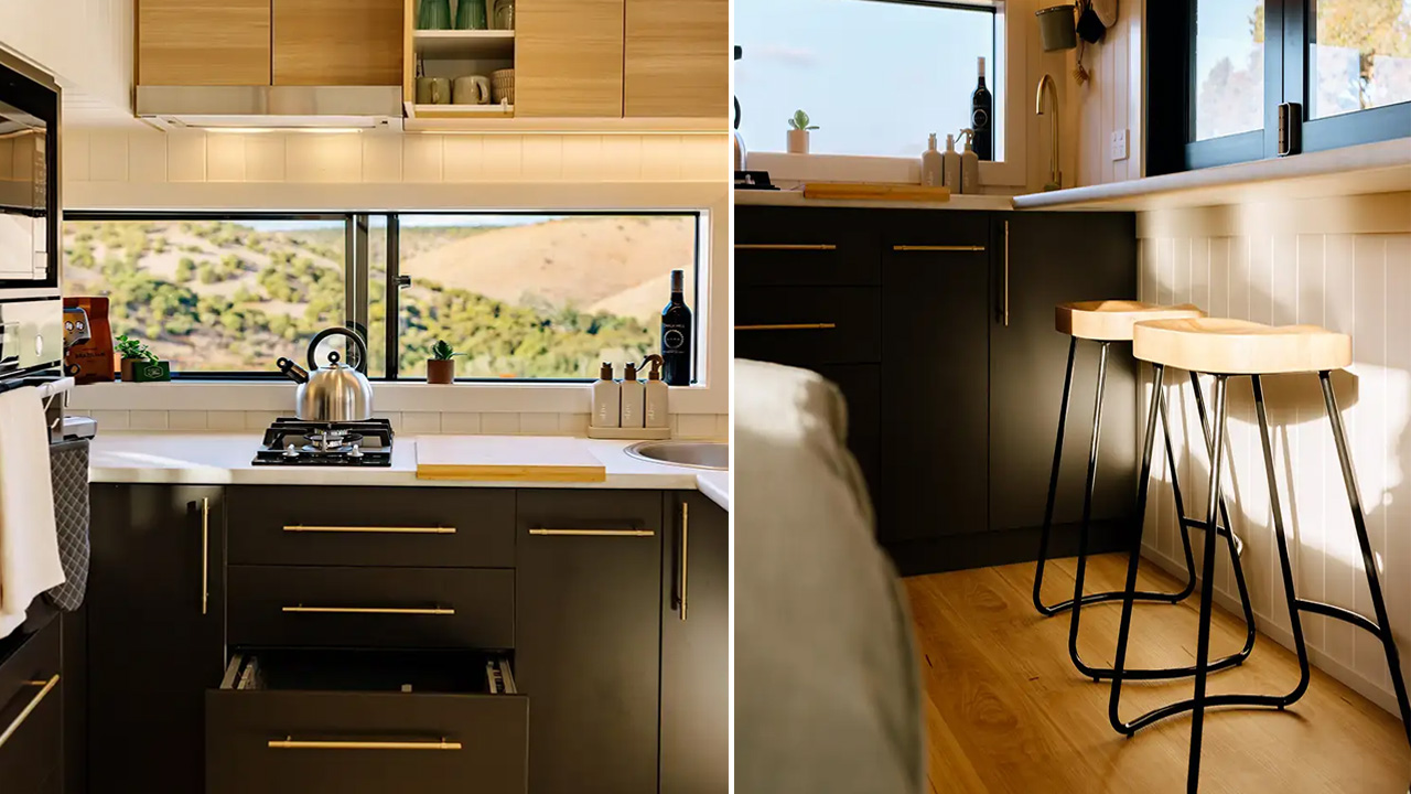 Large kitchen with lot of drawers for storage and countertop serving as dining corner