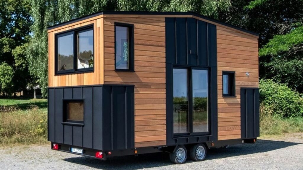 Baluchon Custom Builds Nouvelle Danse Tiny House for Seamstress, Fits Reverse-Loft Inside Dark and Moody Package Baluchon tiny house feature image