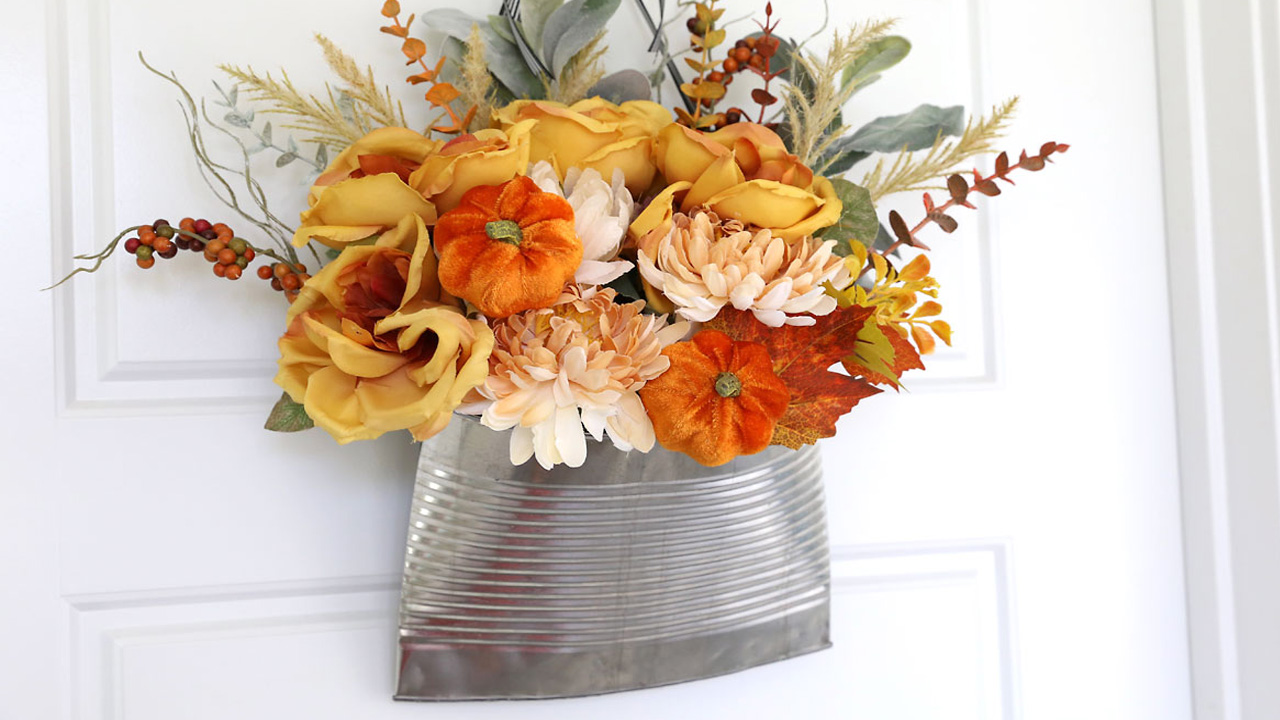 The floral DIY smashed can door looks bright and colorful