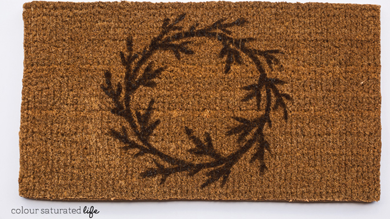 The DIY wreath doormat is too cute to ignore
