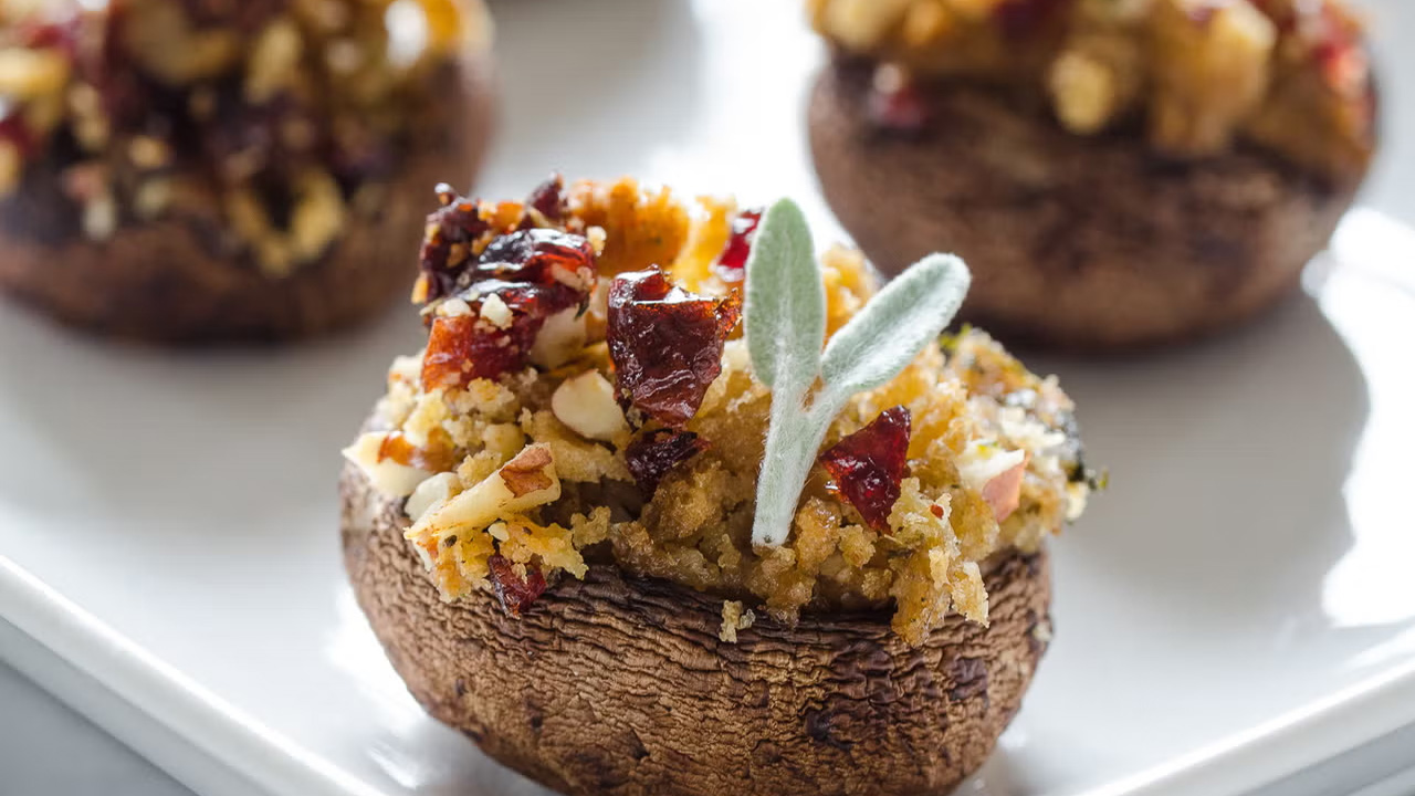 Leftover food mixed with dried cranberries, topped with a tiny sage leaf