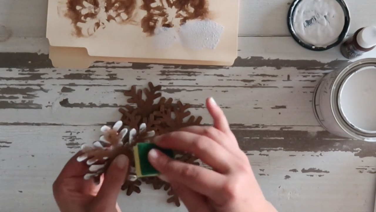 Dab the snowflake's corners with paint