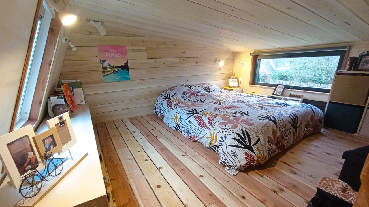 The wooden floor and glazed windows create a warm and cozy atmosphere