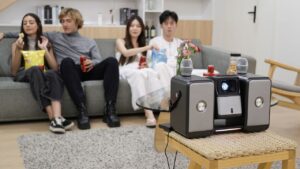 Audiray One Combines 4K Projector, Two 60W Speakers, and a Pair of Wireless Mics in One Unit Audiray One - Portable Projector With Mini Theater