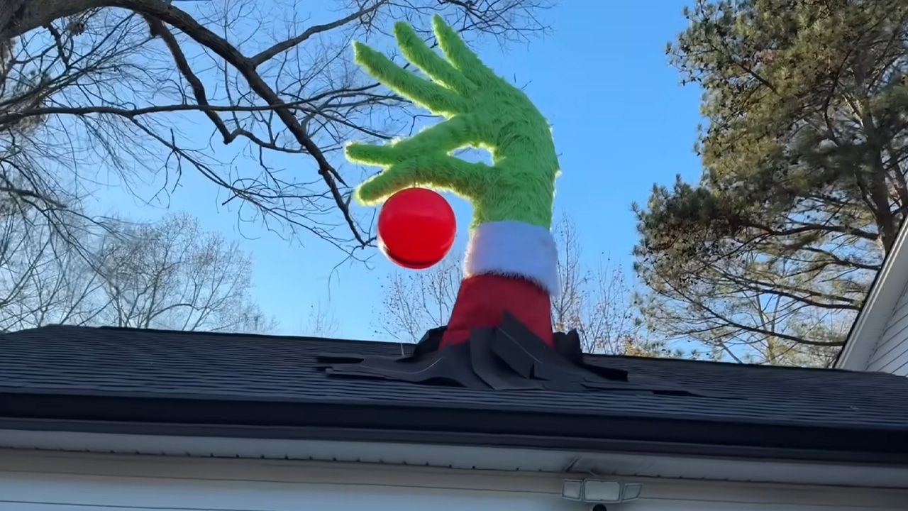 Roof-breaking Grinch hand by Isaac Alexander - 1