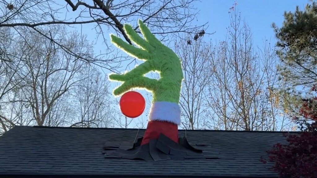 Roof-breaking Grinch hand by Isaac Alexander