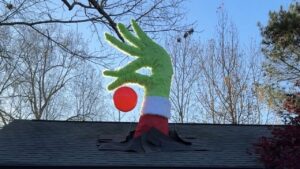 Roof-breaking Grinch hand by Isaac Alexander