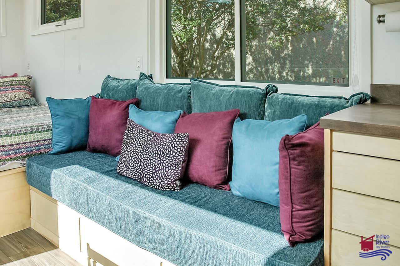 Indigo Go Tiny House Accommodates Everything on a Single Floor - sofa with storage 