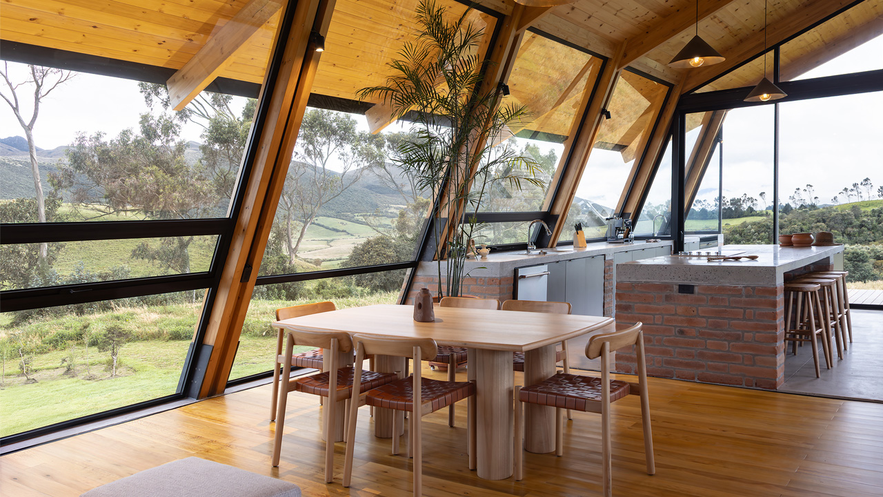 The glazed walls flood the interior with natural light