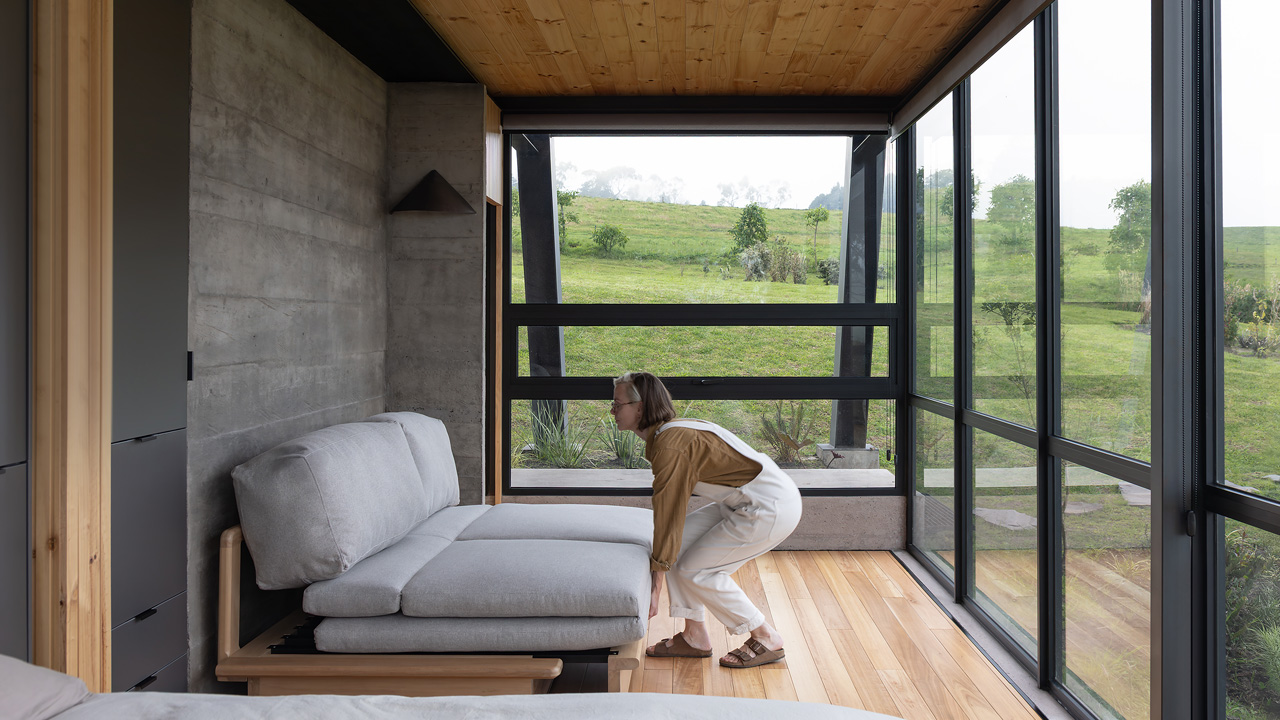 The bedroom is more like a viewing gallery and less like a sleeping area