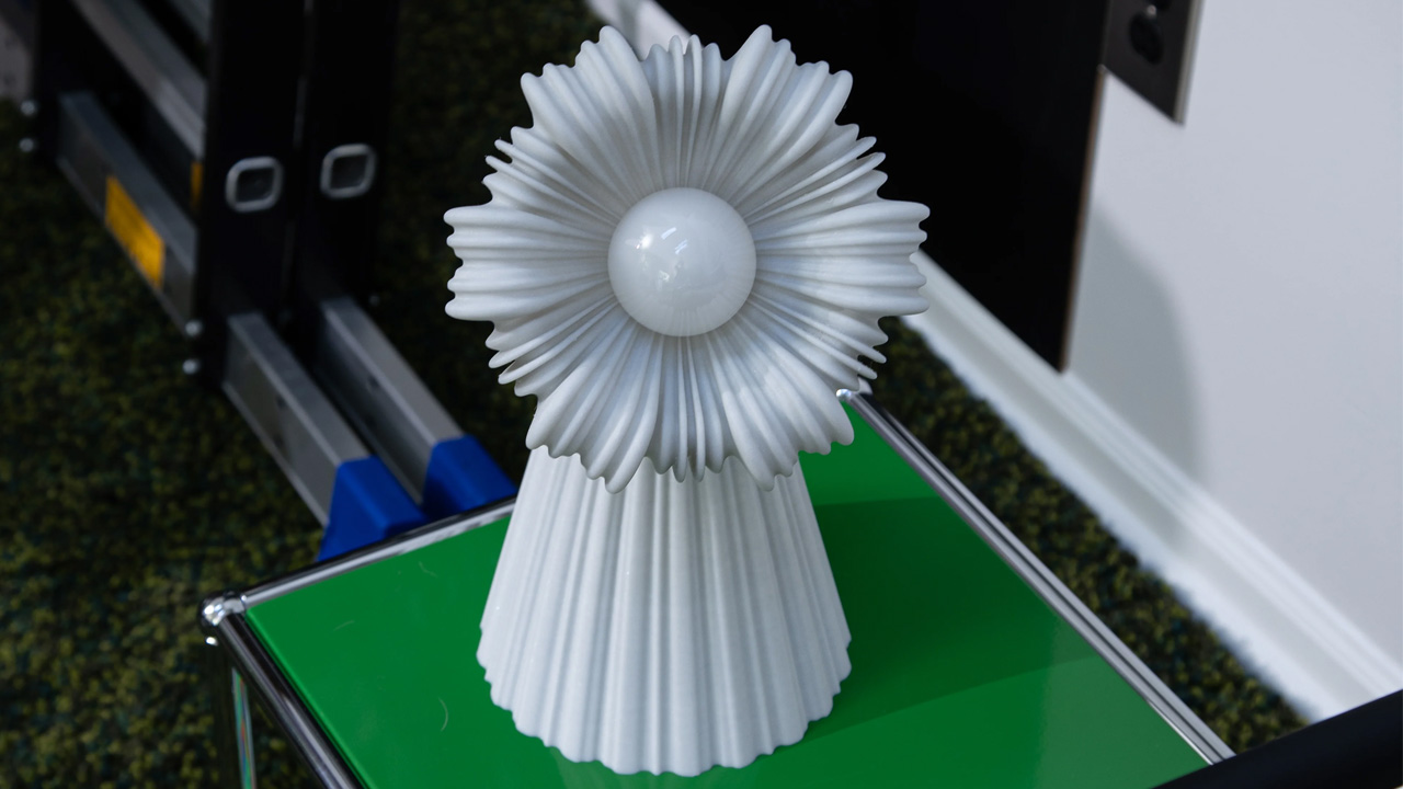 The Poppy table lamp imitates lifelike flower form with its stunning pleated form