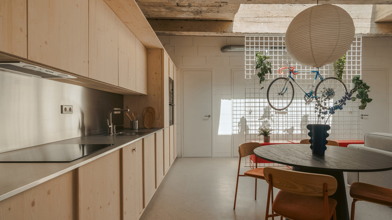 The kitchen has plenty wooden built-in cabinets