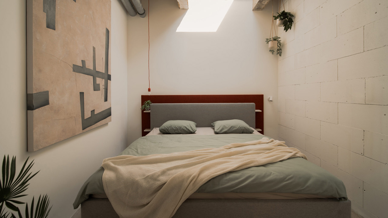 The cozy bedroom has a double bed