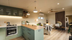 $140K Tiny House Feels Like Strolling Through a 13-Foot-Wide English Garden The English Garden Tiny Homes lounge and kitchen