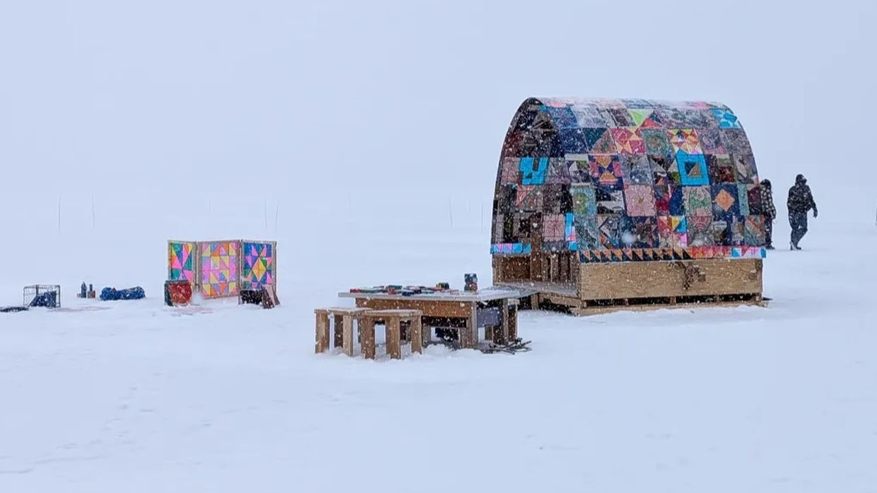 The Quilt Shanty contrasts beautifully against the snow backdrop
