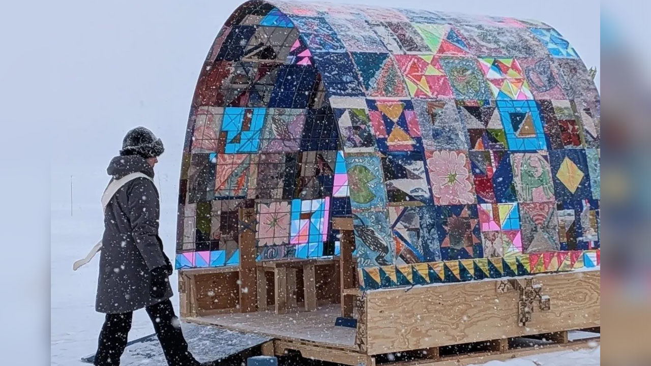 The quilt-covered loop house looks like a giant textile scupture