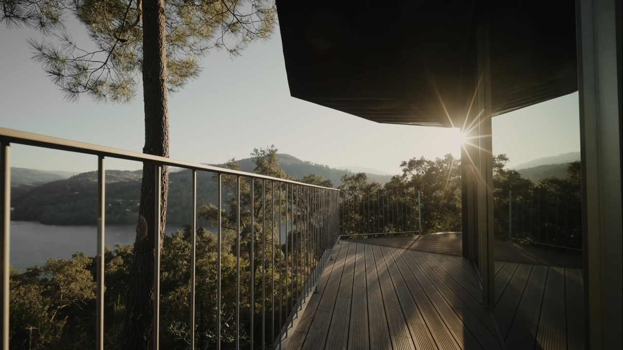 The wooden house becomes an architectural retreat enveloped by nature