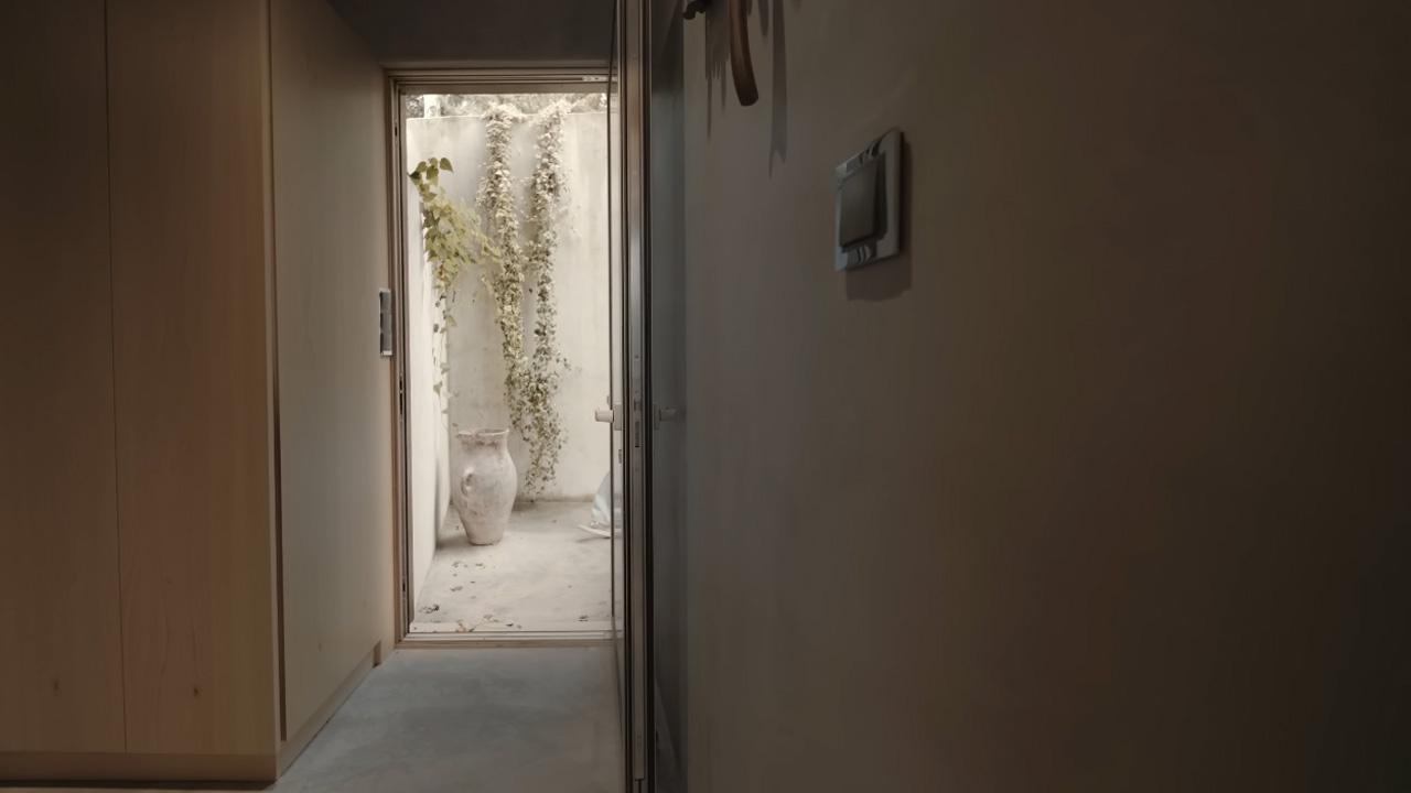 The glazed door opens into a luxurious interior