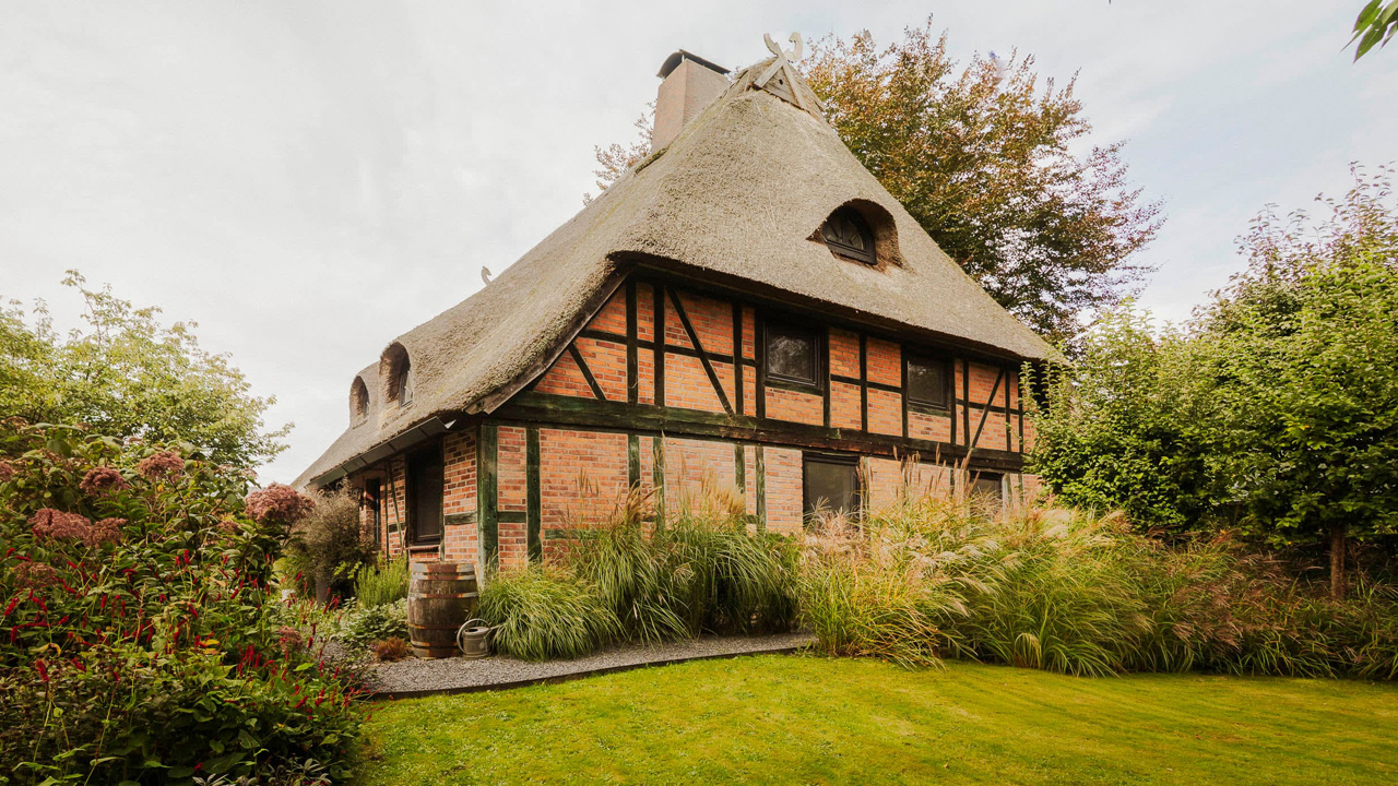 The Smokehouse of Poggensee sits amid lush gardenscape