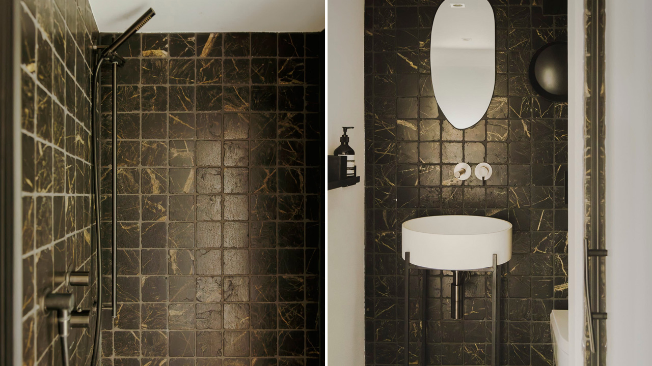 The bathroom has a shower and a suspended sink