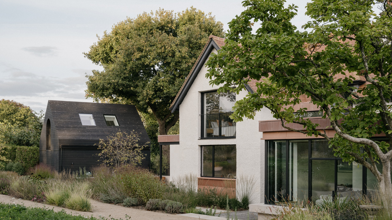 The architecture of the renovated Edwardian villa stretches outwards into the garden