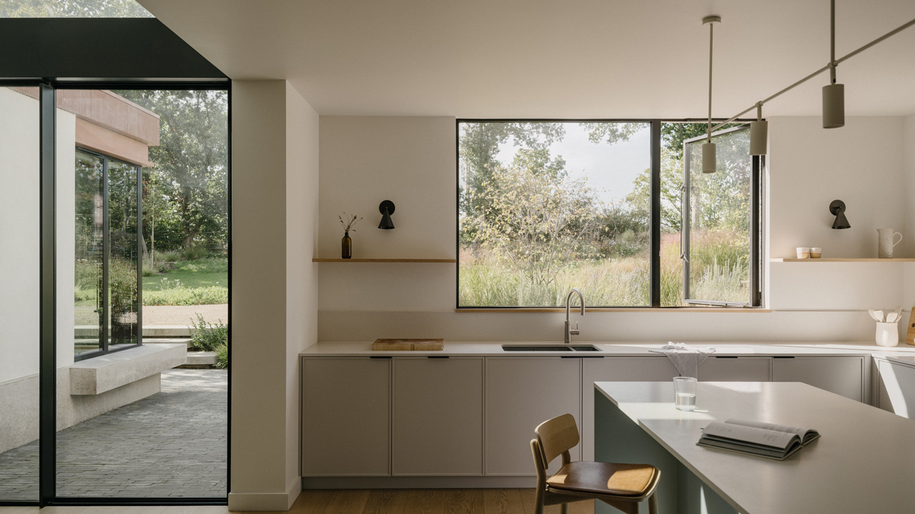 The kitchen and dining room has a muted and sophisticated soft tone
