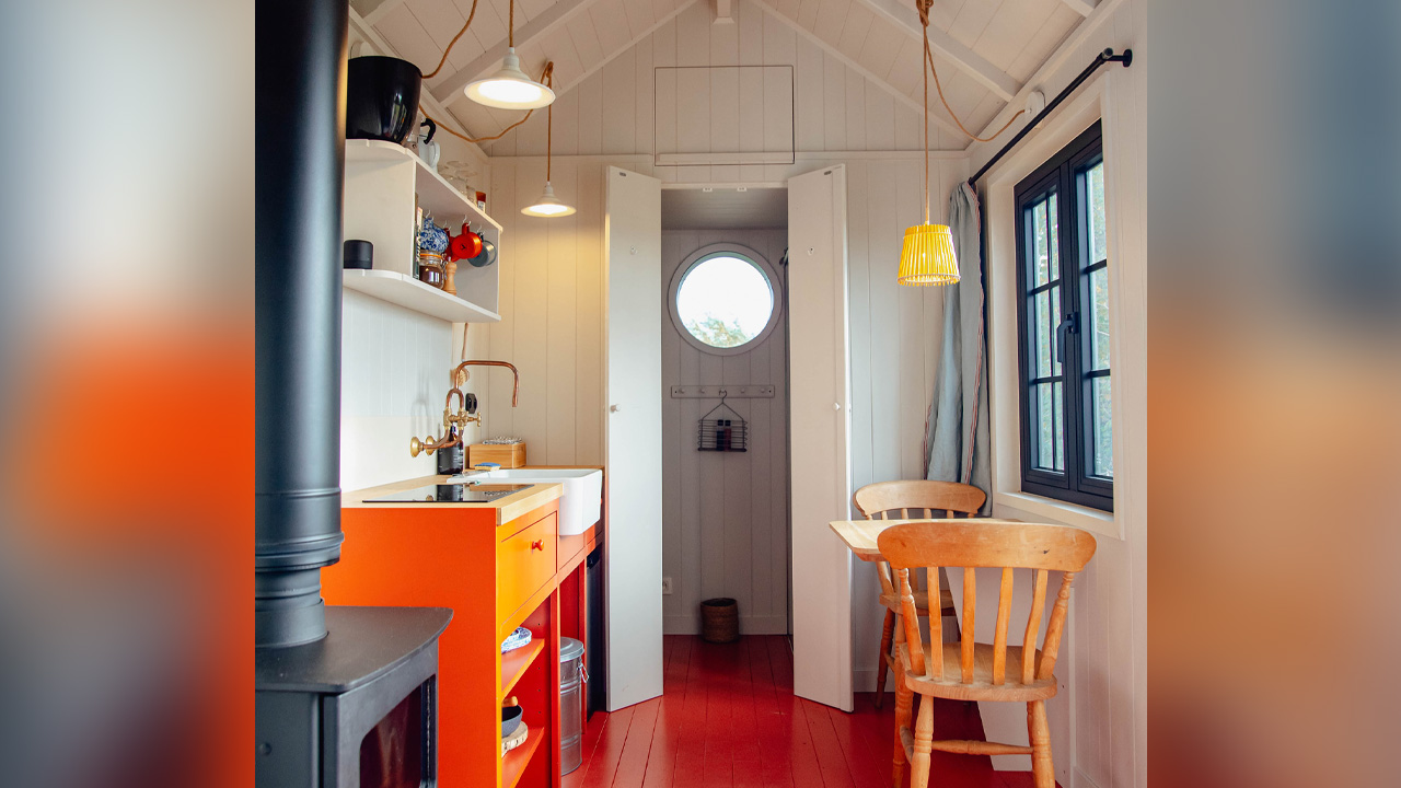 The luxurious interior looks striking against neutral shiplap