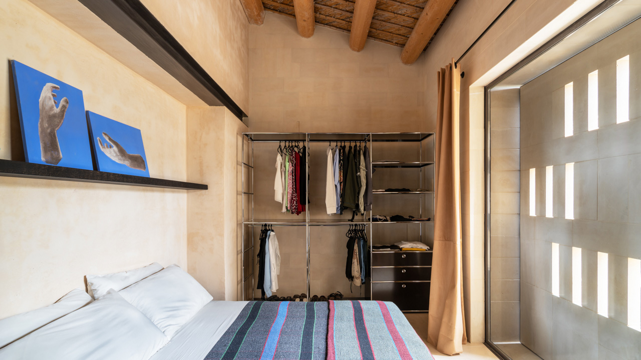 The cozy bedroom gets ample brightness through the window