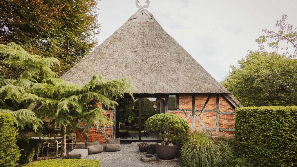 $2M German Cottage With Exposed Brick Exterior and Traditional Thatched Roof is Masterclass in Preservation Traditional Thatched Architecture of Smokehouse of Poggensee Transforms Into Modern Architectural Sanctuary