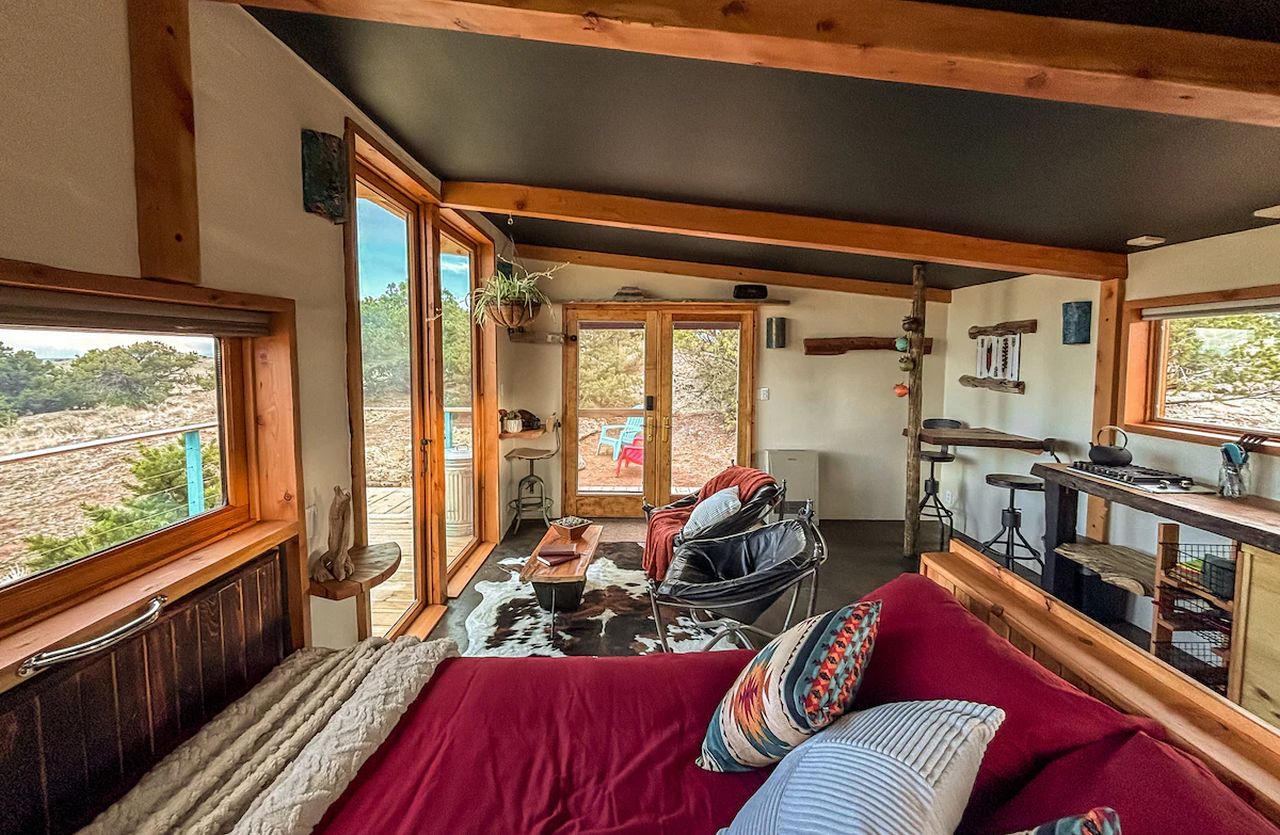 Cabin in Del Norte, Colorado_interior with bed, living area, kitchen, and dining area