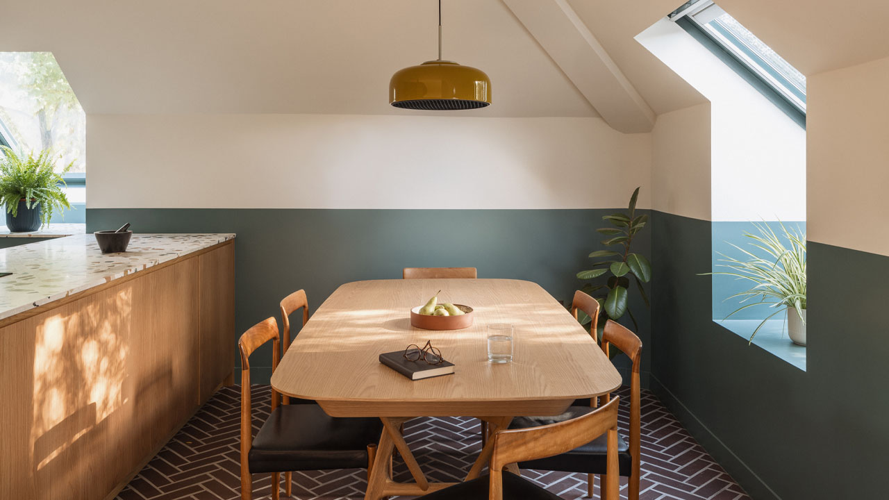 The ground floor has a wooden dining table