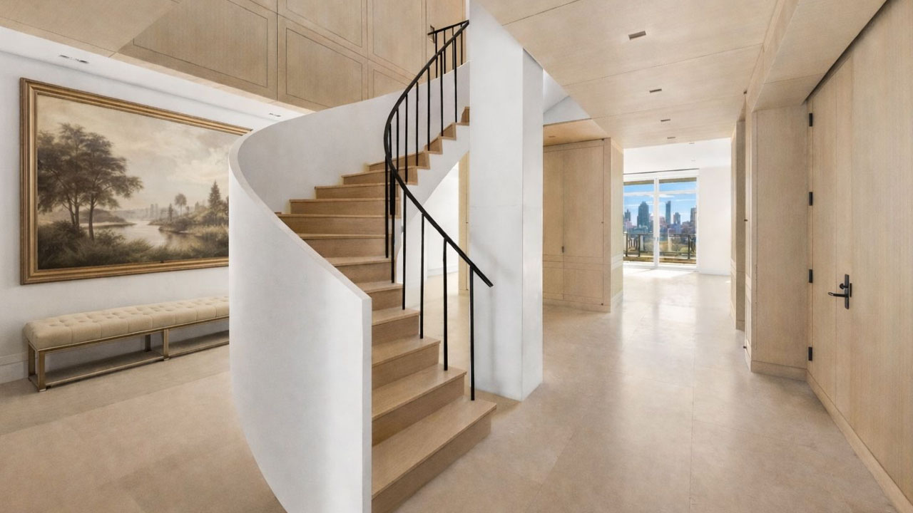 The statuesque spiral staircase in entrance foyer