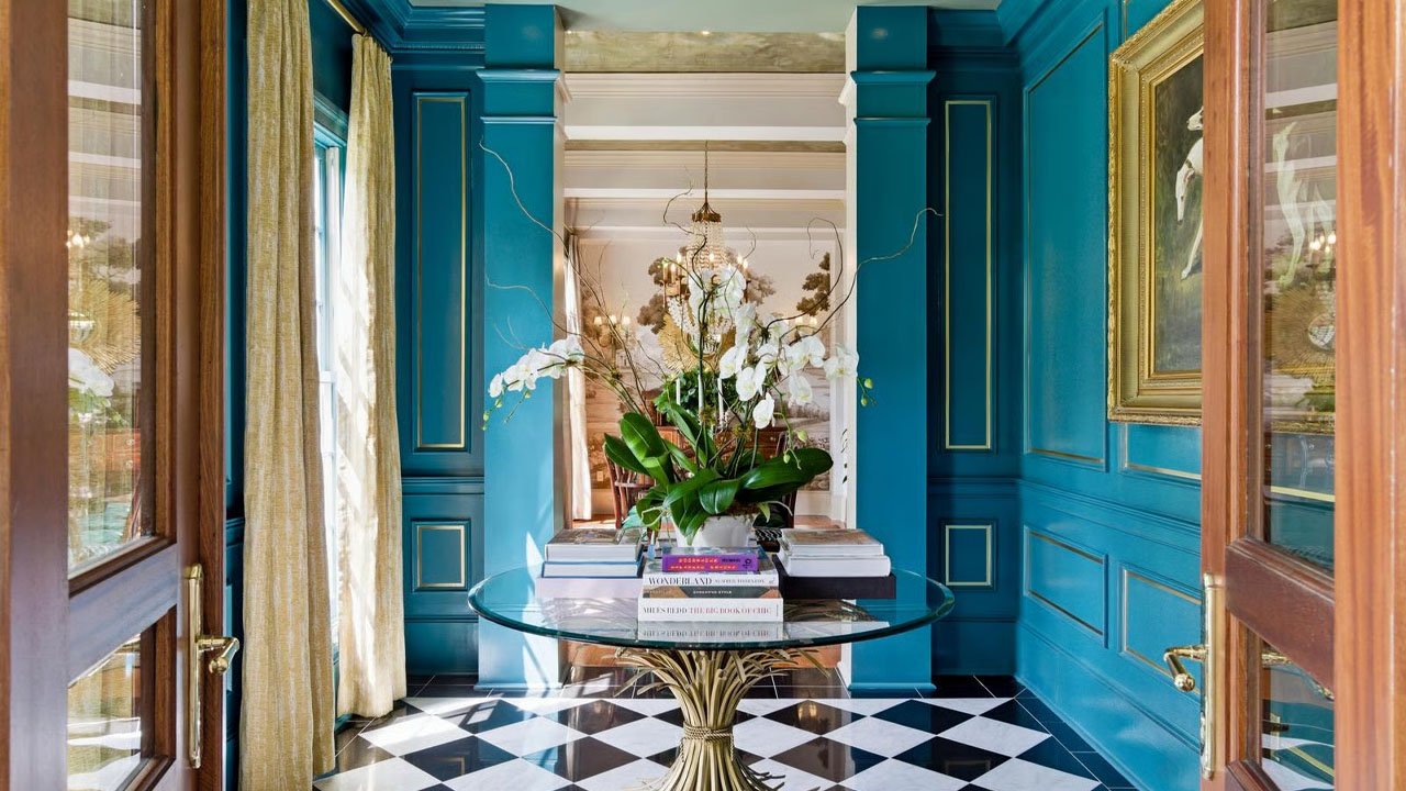 The gorgeous blue colored walls contrast against the checkered floor