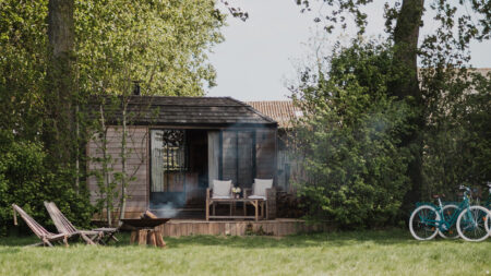 Josephine Tiny House Offers Luxury Cedar Hideaway for Couples Lush greenery envelops the tiny house