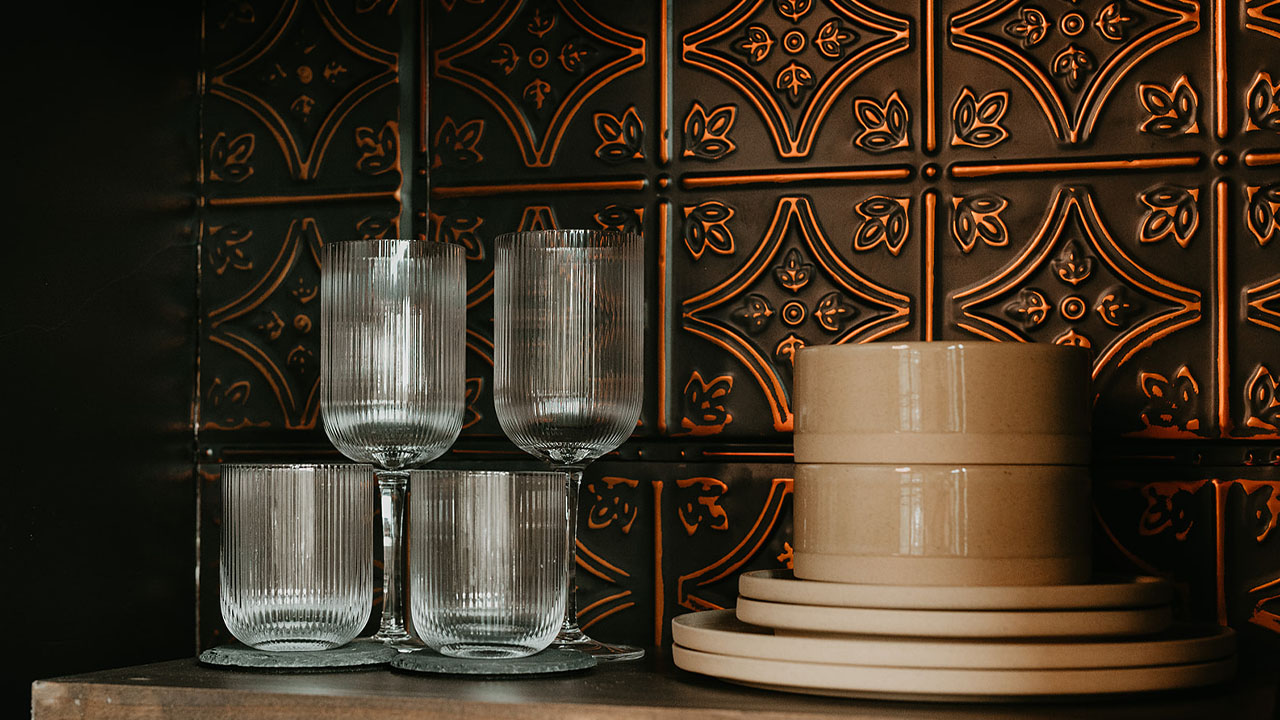 The copper-toned pressed tin backsplash 