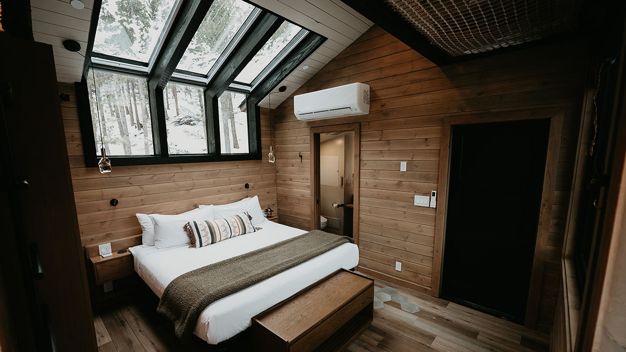 Gaze at the starry night sky while you lie down on the cozy king size bed through sky wall of the luxury treehouse hotel