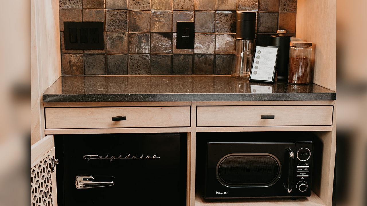 The spacious kitchen has captivating backsplash.