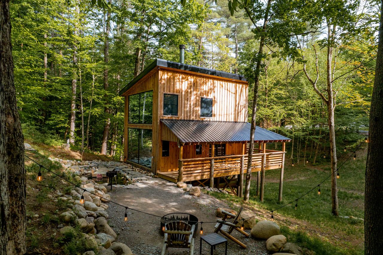 The Treehouse Cabin_outdoor seating, firepit, and pond