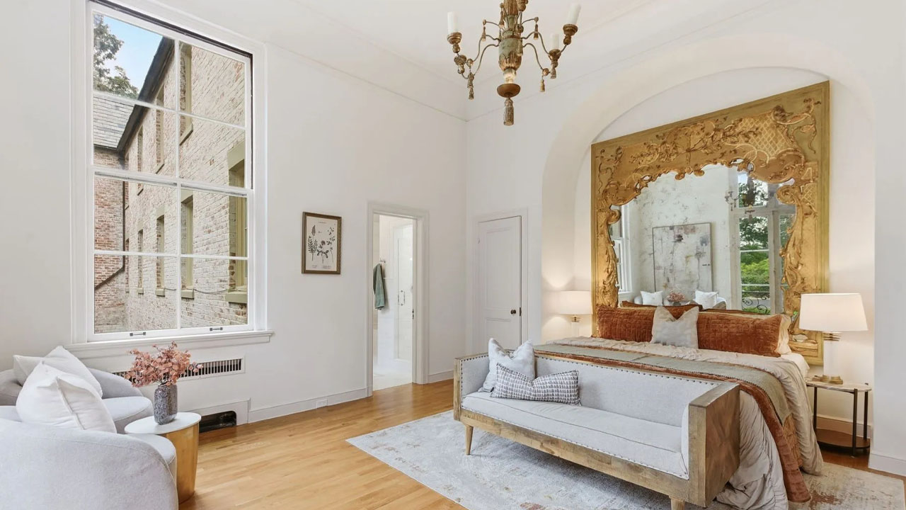 The hard wood floor complements the light-toned walls and rugs