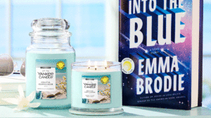 Yankee Candle x Reese’s Book Club Launch Coastal Cliffhanger for Summer Yankee Candle x Reese's Book Club Coastal Cliffhanger for Summer