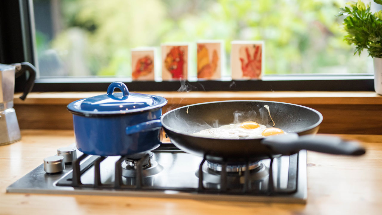 The stoves in wooden kitchen countertop