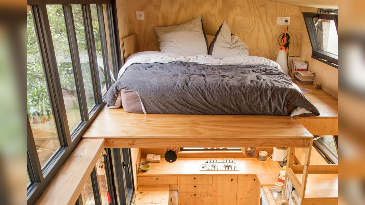 The primary loft bedroom sleeps two people