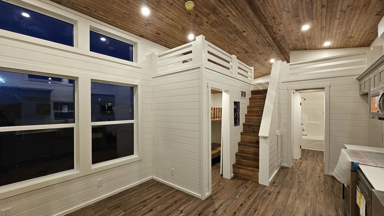The spacious wood-clad interior evokes cozy, cabin-like feeling