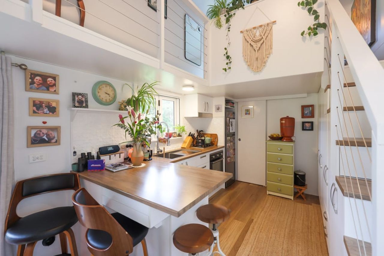 Koby’s Tiny House Features Two Standing Lofts With Connecting Catwalk