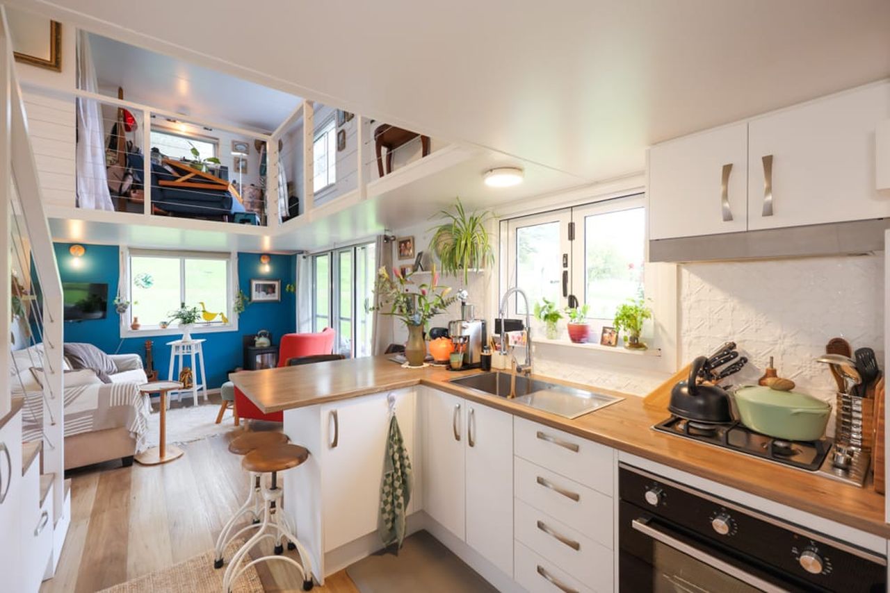 Koby’s Tiny House Features Two Standing Lofts With Connecting Catwalk
