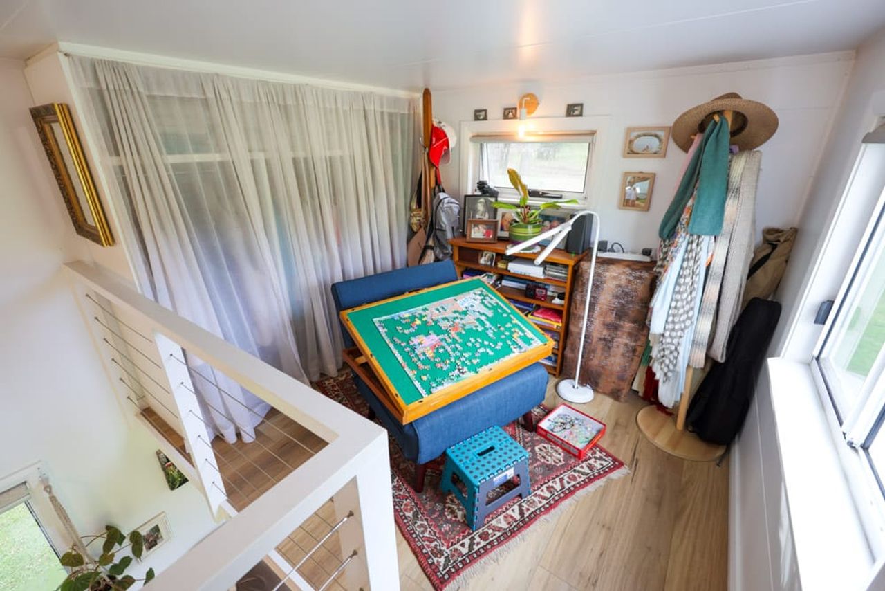 Koby’s Tiny House Features Two Standing Lofts With Connecting Catwalk