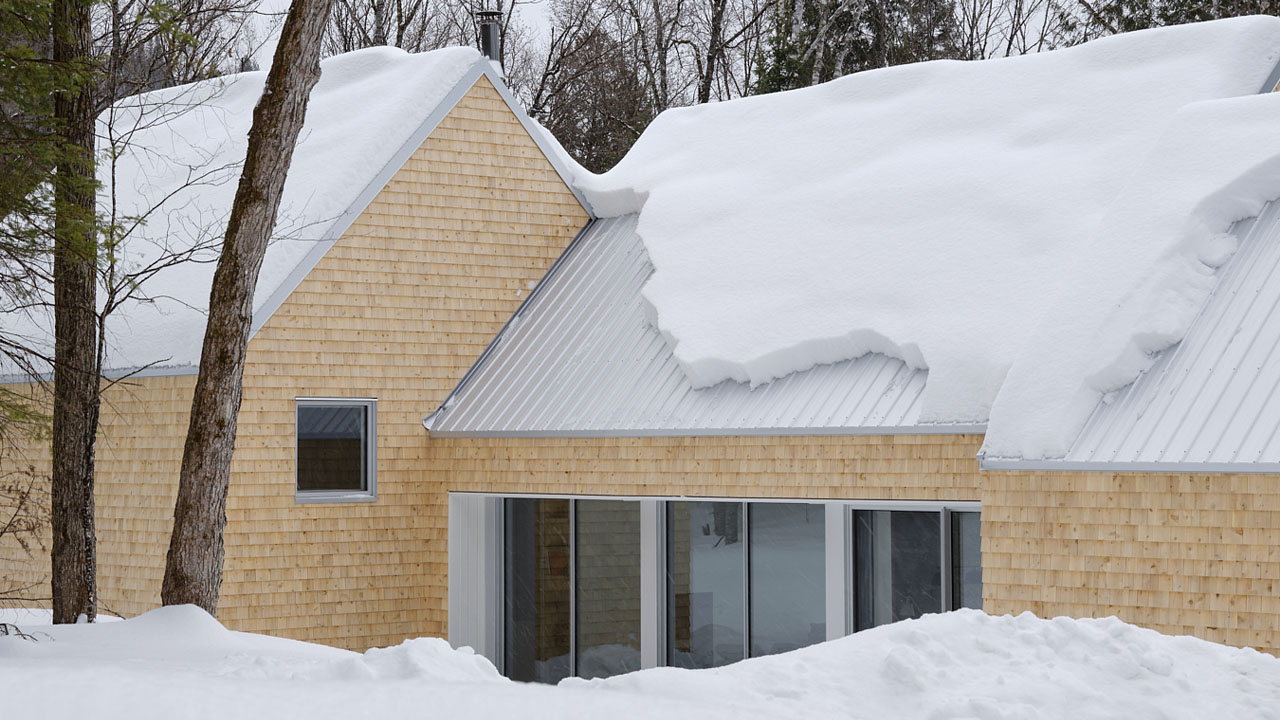 The steep roof slides off snow